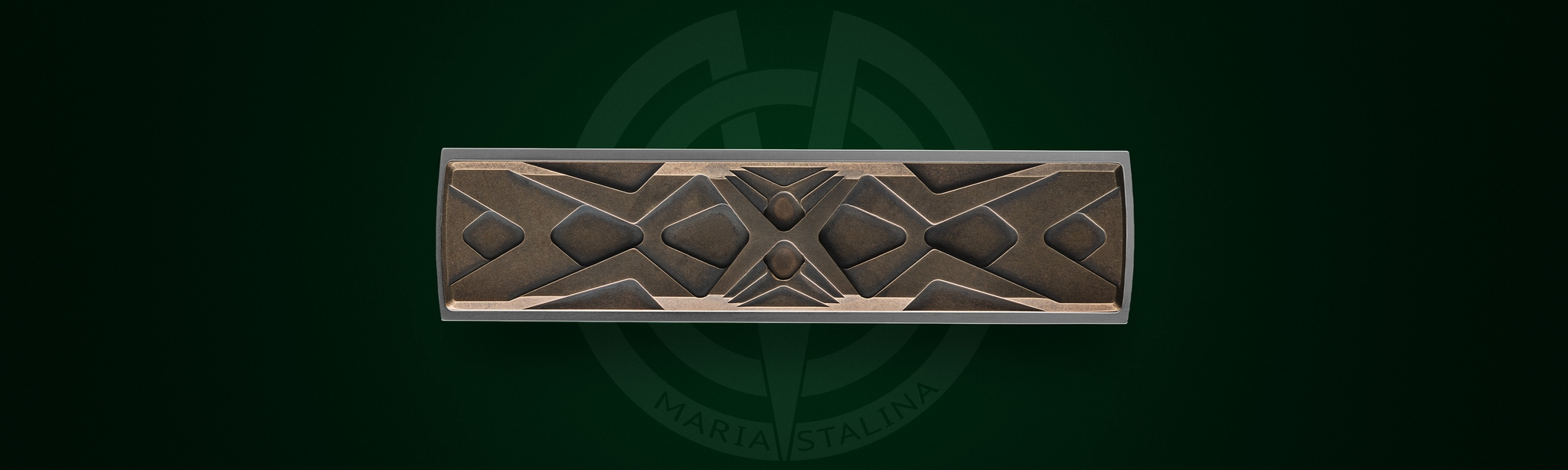 Close-up of the bronze inlays and decorative Art Deco pattern on Égocentrique 2026