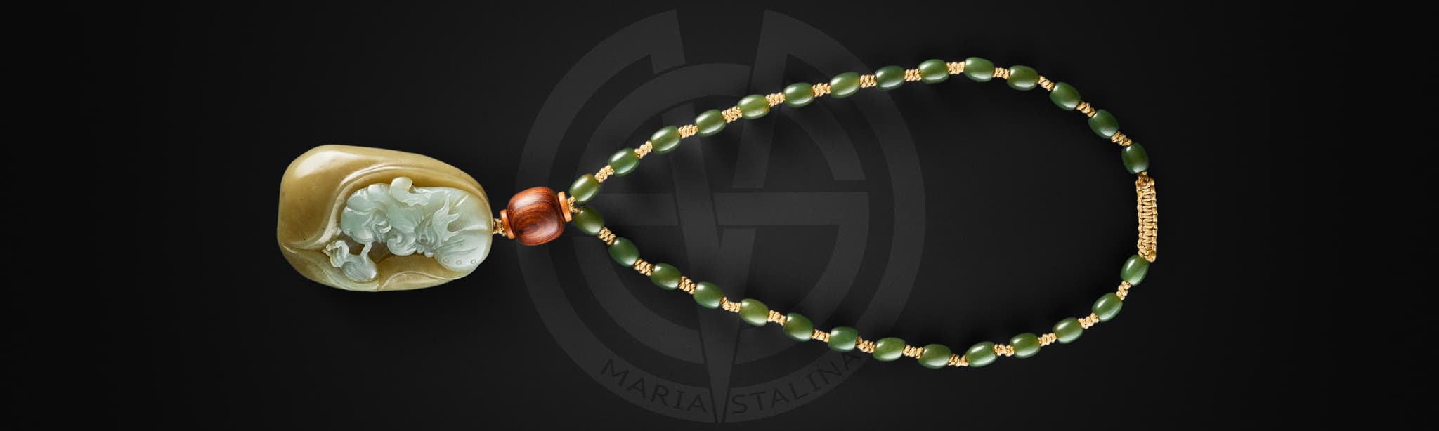 Front view of Yun Jin Luo jade amulet with carved arhat and beads