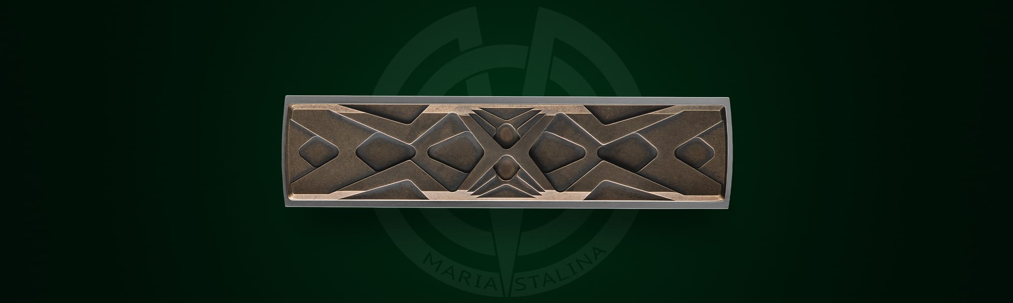 Close-up of the bronze inlays and decorative Art Deco pattern on Égocentrique 2026