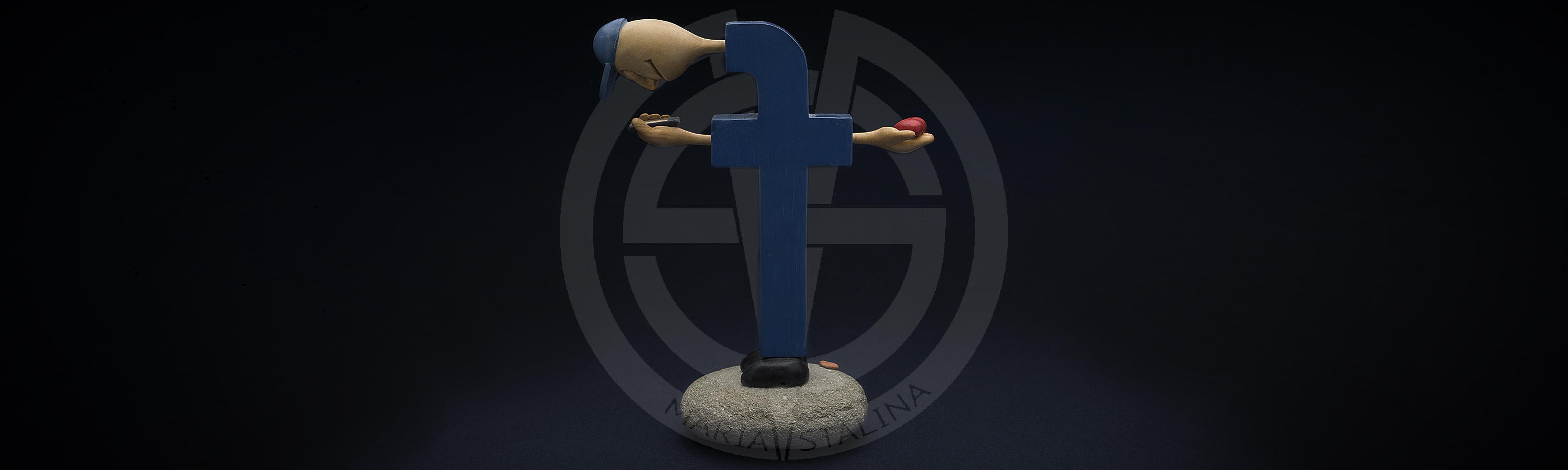 Wooden statuette Facebook