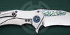 The mirror-polished blade is adorned with the jewelry abalone inlay